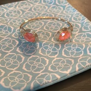 Kendra Scott coral colored cuff in yellow gold